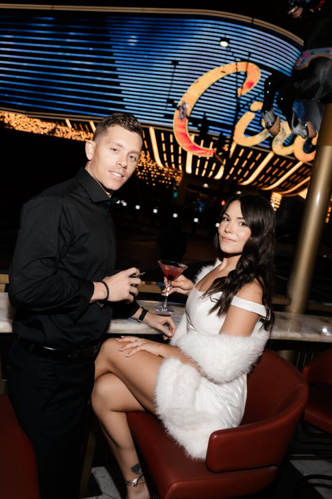 Couple having drinks at night at Carousel Bar in Las Vegas.
