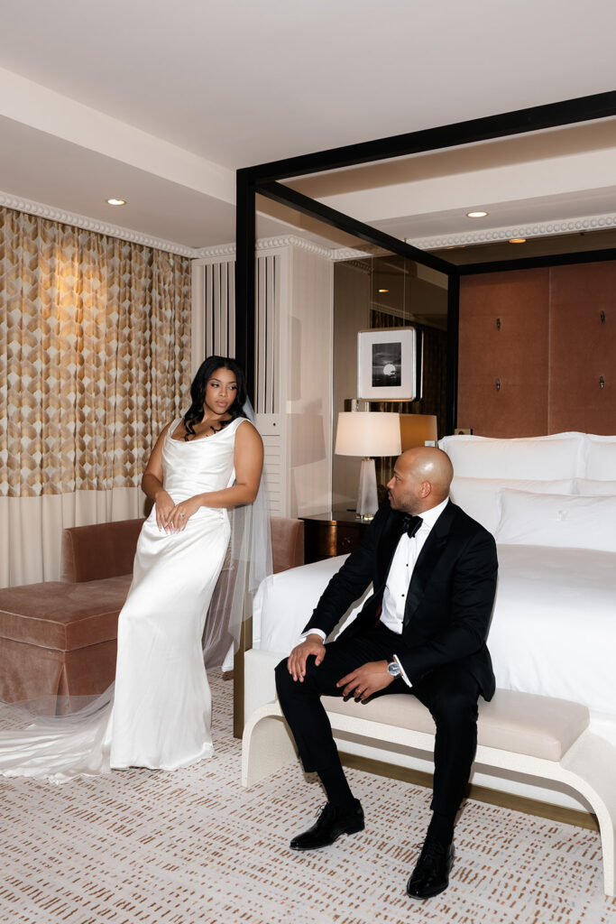 Bride and groom posing in their Wynn Las Vegas hotel suite. 