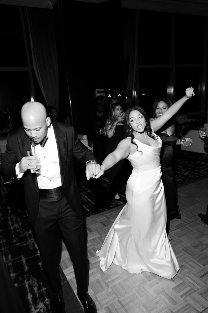 Black and white photo of a bride and groom dancing during a Wynn Las Vegas wedding reception. 