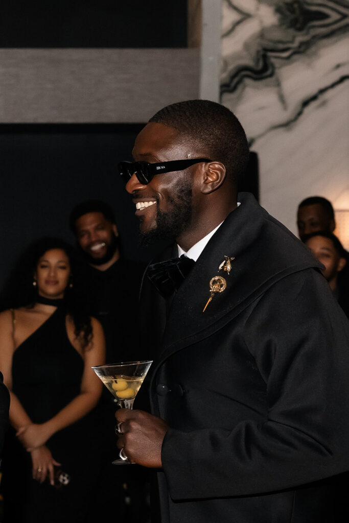 Guest smiling during speeches. 