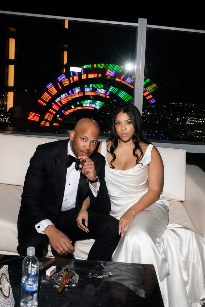 Bride and groom posing on a rooftop during a Wynn Las Vegas wedding reception.