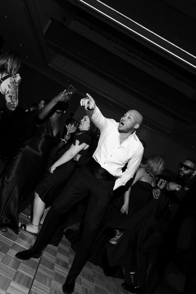 Groom dancing during his Wynn Las Vegas wedding reception.