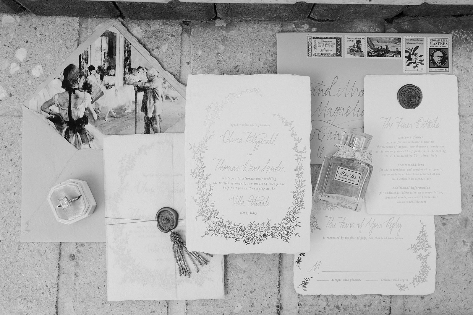 Wedding invitation flat lay with rings and perfume for Las Vegas wedding content creator detail coverage.