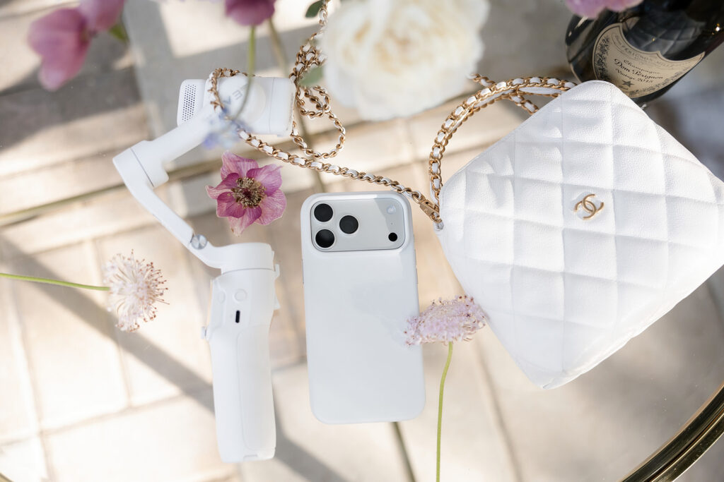 iPhone and content creator tools styled flat lay for Las Vegas wedding content creator coverage.