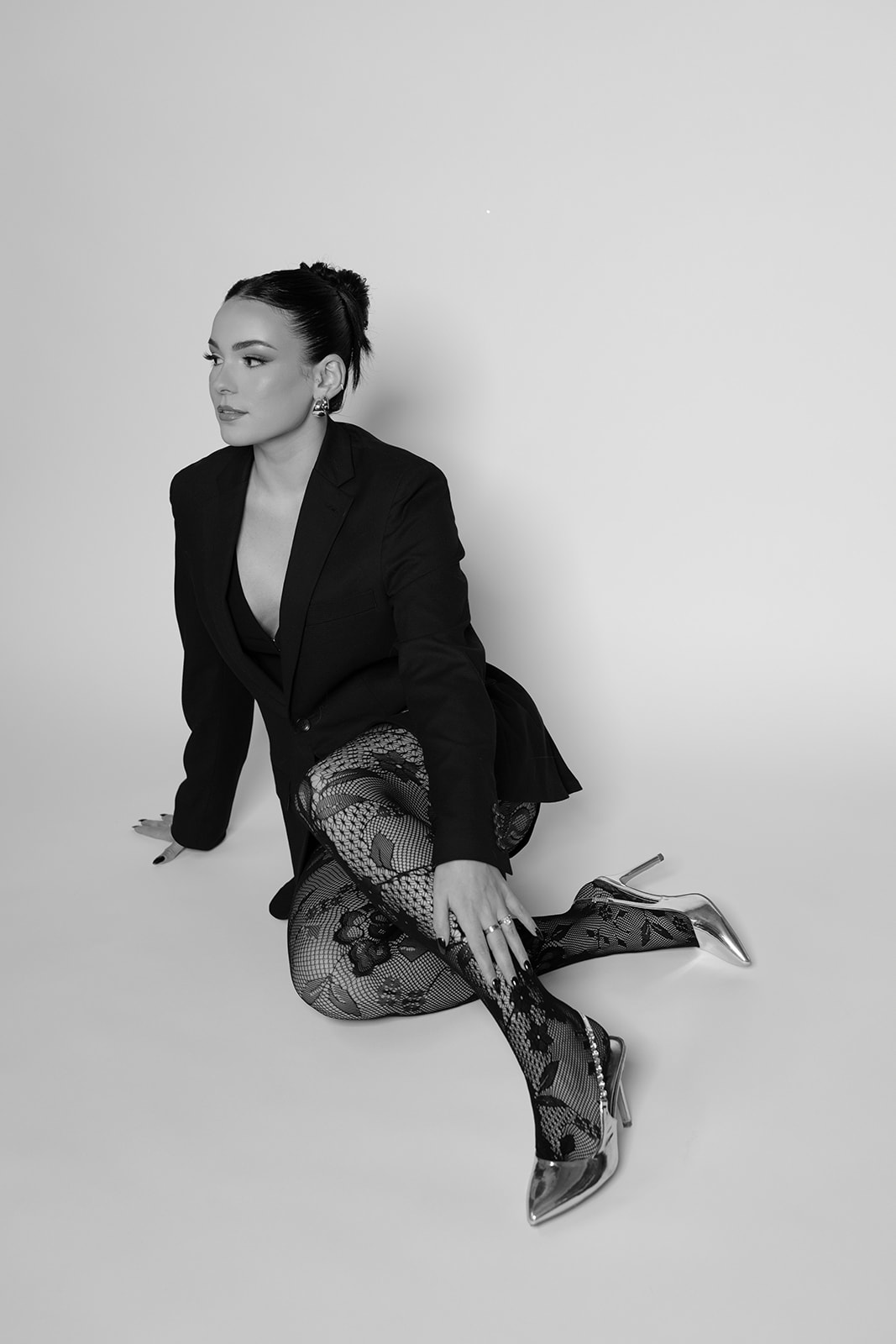 Black and white portrait of Kyra of Risky Exposure Photography, a Las Vegas wedding and elopement photographer.