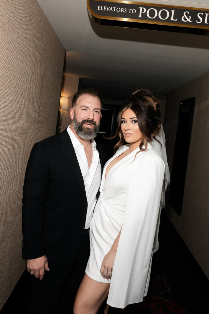 Bride and groom portrait in a hotel hallway at Wynn Las Vegas before their luxury elopement.