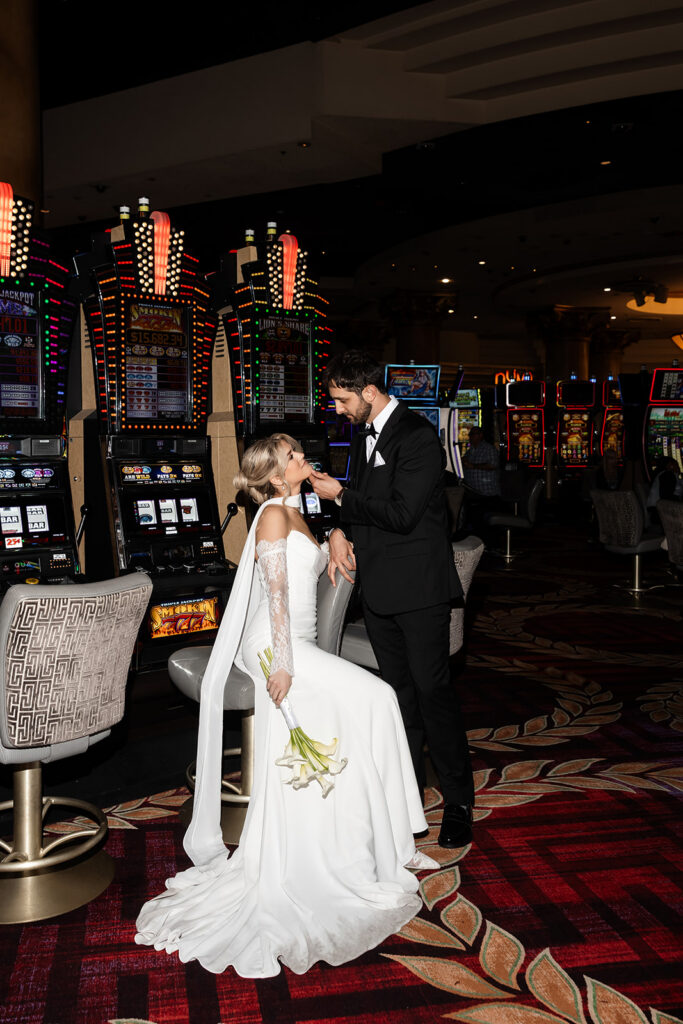 Bride and groom taking portraits inside the Caesars Palace casino in Las Vegas.