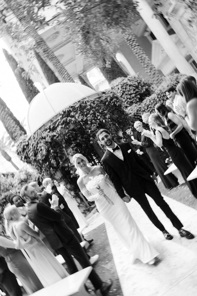 Newly married bride and groom walking down the aisle after their ceremony at the Venus Garden Chapel at Caesars Palace.