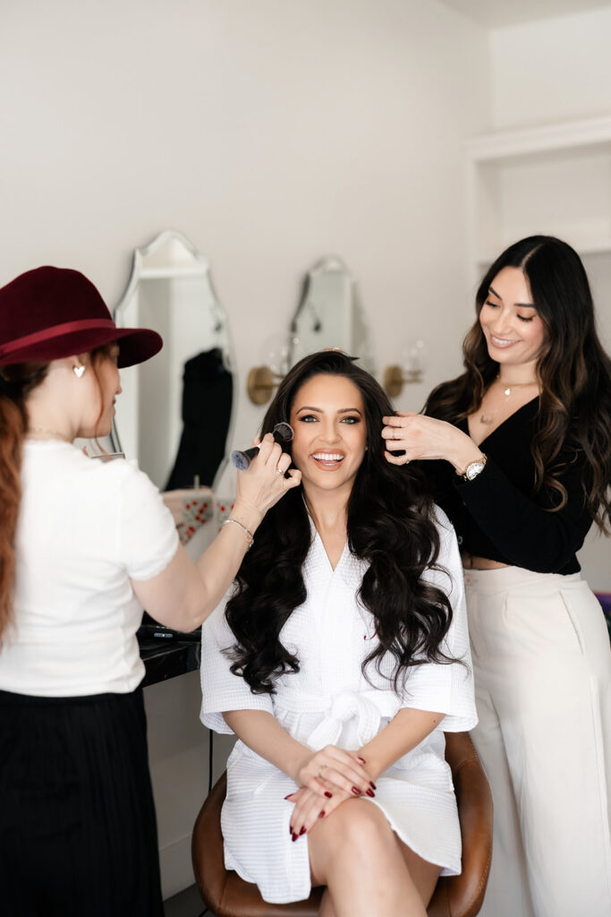 Bride getting her hair and makeup done in one of the getting ready suites at The Lotus House in Las Vegas.