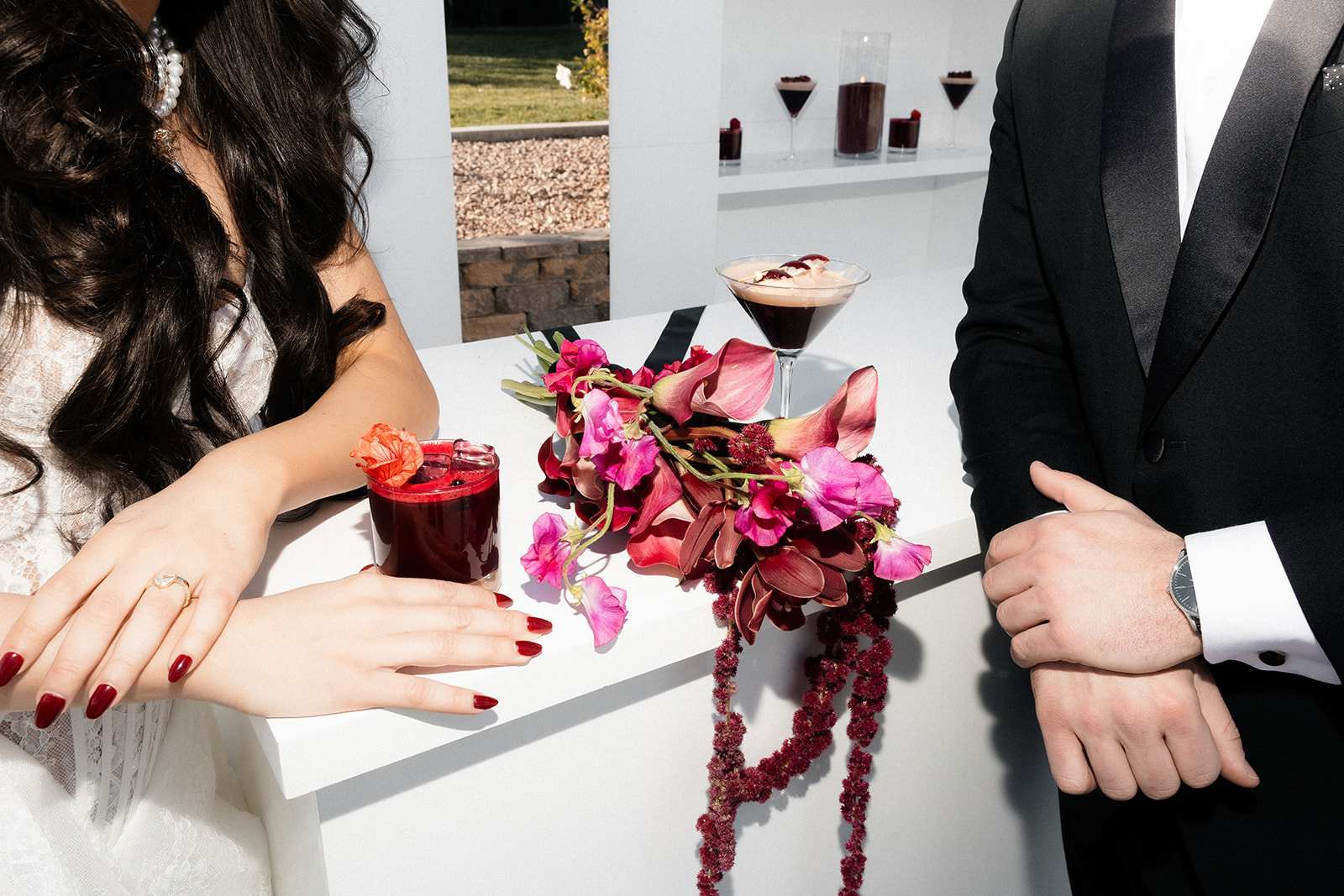 Close up shot of a bride and groom enjoying cocktails during cocktail hour.