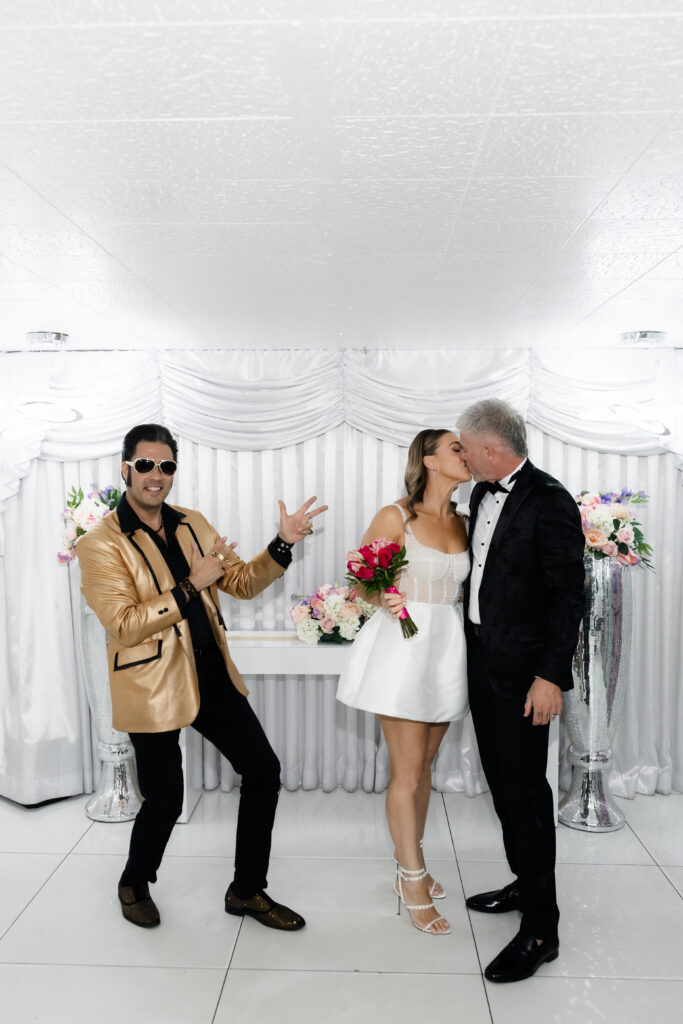 Bride and groom kissing during their Las Vegas vow renewal.