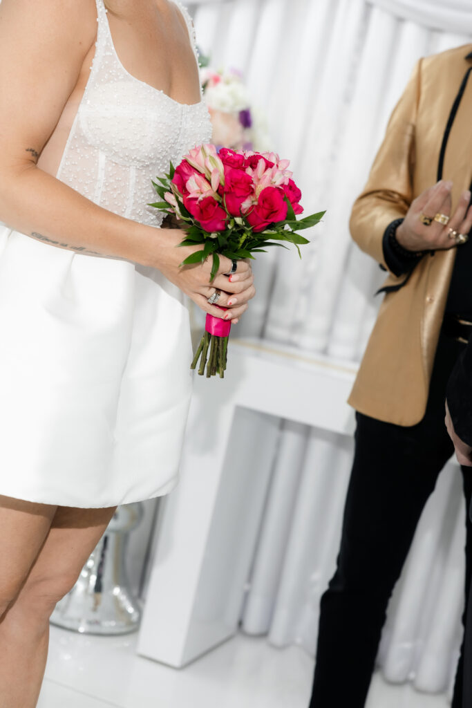 Close up of a bride holding her bouquet during her Elvis Las Vegas vow renewal.
