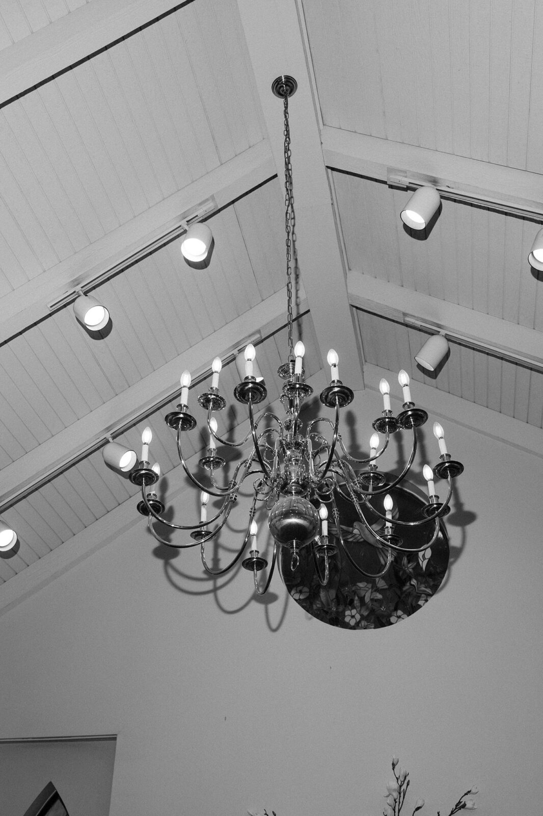 Black and white close up shot of the overhead chandelier inside A Special Memory Wedding Chapel in Las Vegas.