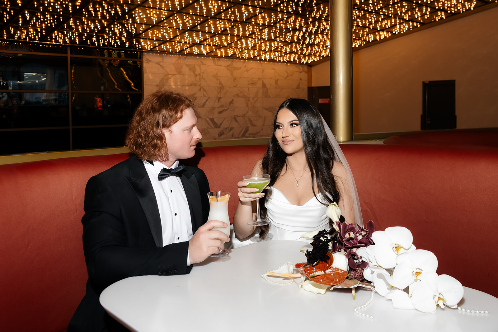 Couple having drinks in a booth at Carousel Bar on Fremont Street in Las Vegas.