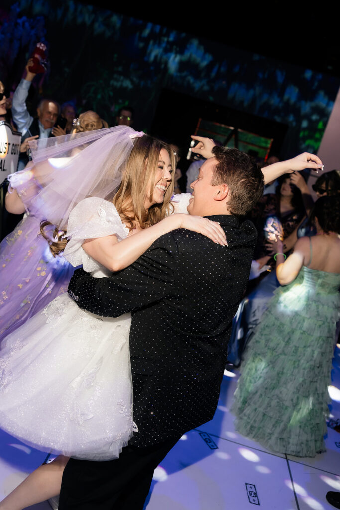 Bride and groom dancing during their Area15 wedding reception in Las Vegas.
