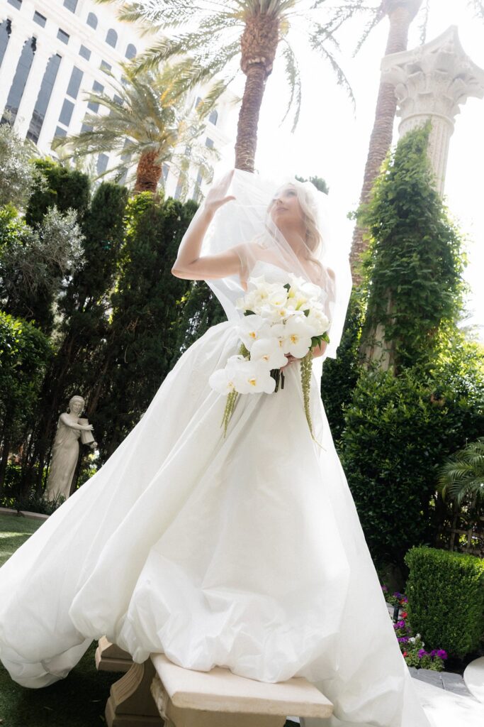 Editorial bridal portrait under her veil in Venus Gardens at Caesars Palace.