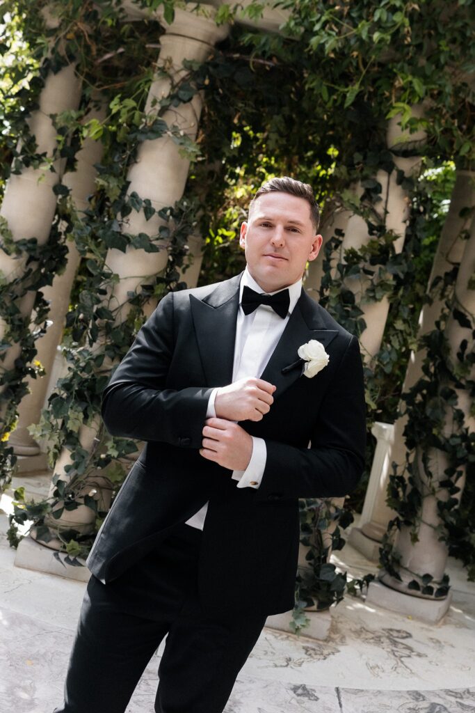 Groom posing in Venus Garden ar Caesars Palace.