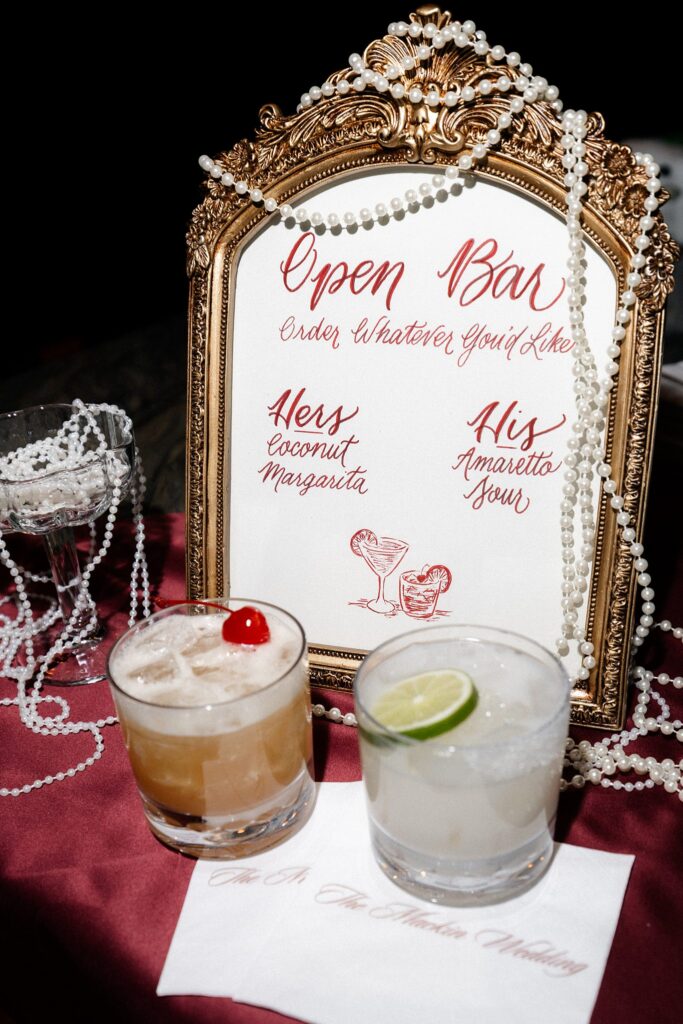 Open bar signage with his and hers cocktails wedding reception detail shot.