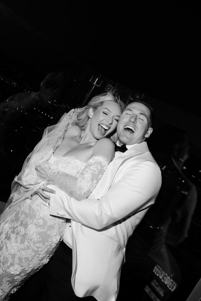 Black and white photo of a couple posing on the rooftop at Ghostbar at The Palms in Las Vegas.