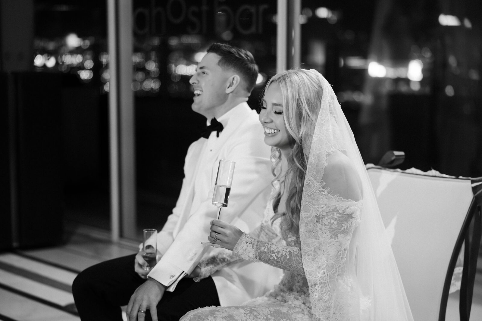 Bride and groom laughing with their guests during their Ghostbar wedding reception in Las Vegas.