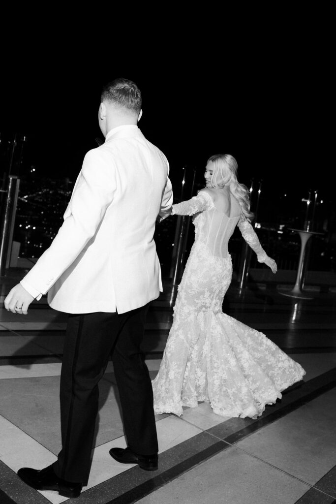 Black and white photo of the bride haring a rooftop dance at Ghostbar at The Palms.