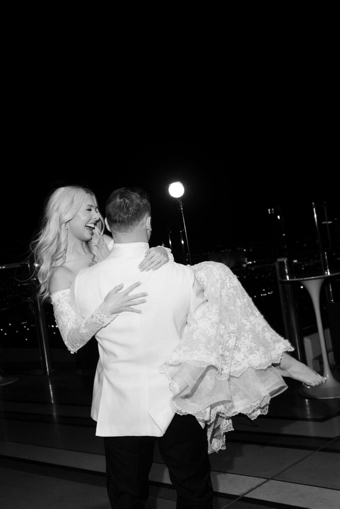 Black and white photo of the bride haring a rooftop dance at Ghostbar at The Palms.