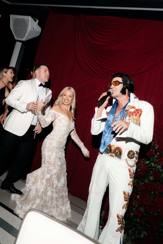 Elvis impersonator Travis Allen Elvis performing during a lively Las Vegas wedding reception at Ghostbar.