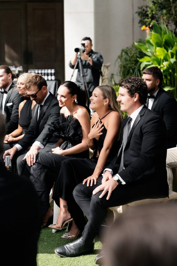 Guests watching emotionally.