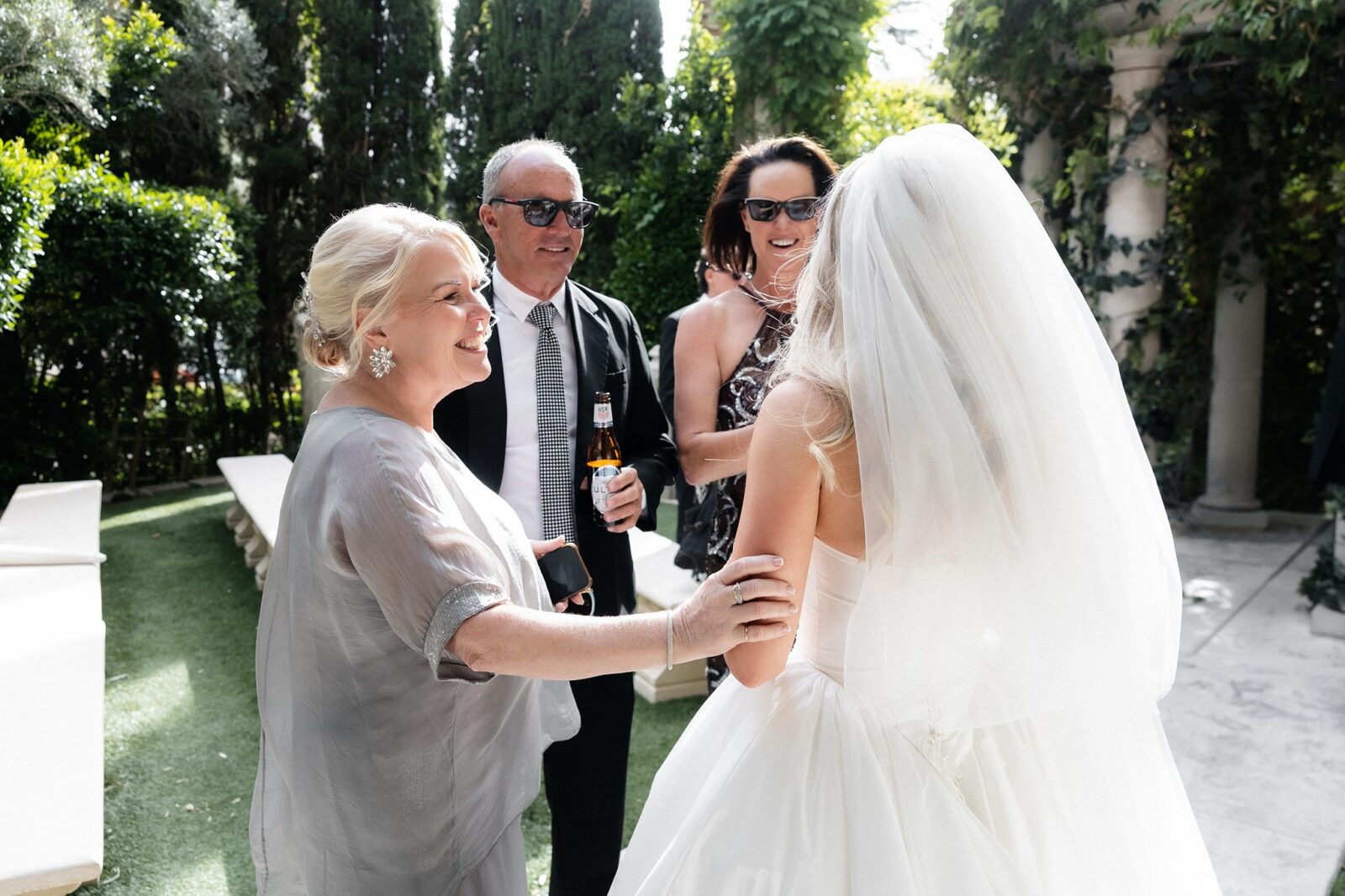 Bride mingling with guests after her Venus Garden Caesars Palace wedding. 