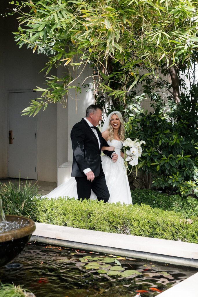 Father walking the bride for her Venus Garden Caesars Palace wedding ceremony.