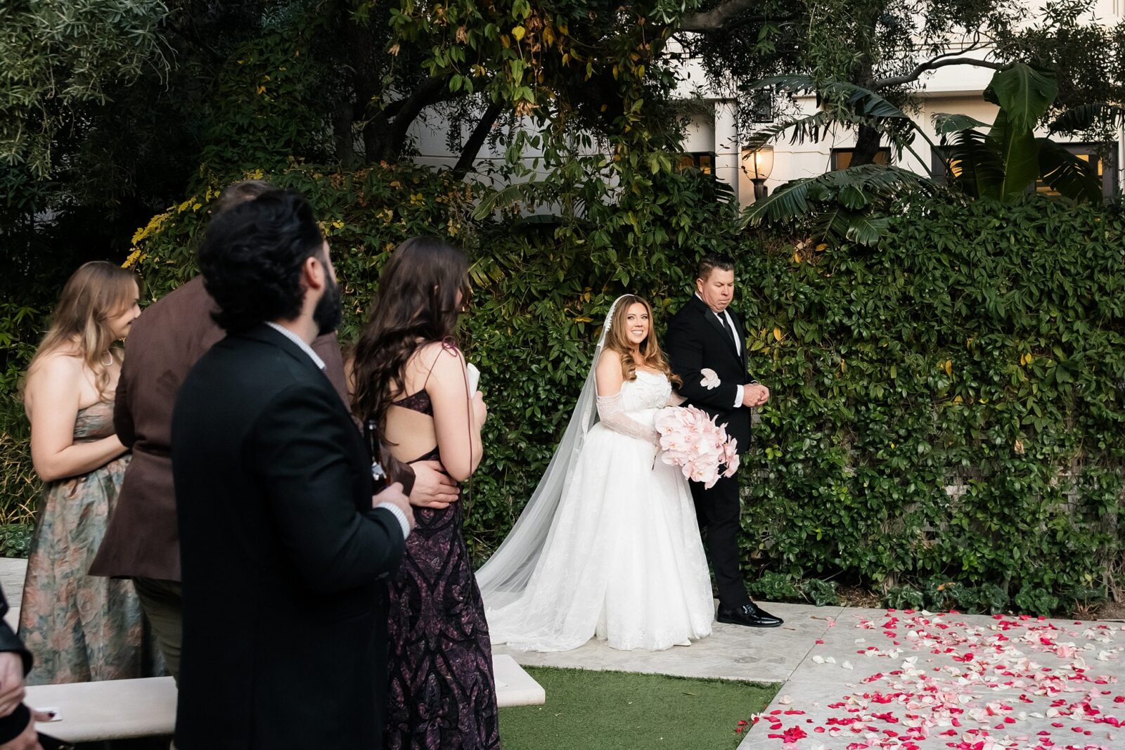 Bride walking down the aisle with her father.