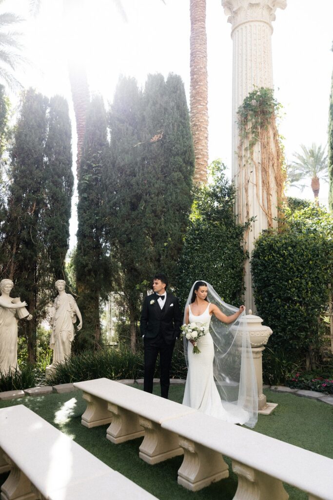 Bride and groom posing inside Venus Garden at Caesars Palace.
