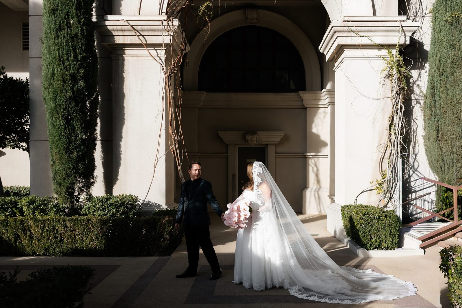 Bride and groom walking through the grounds at Caesars Palace.